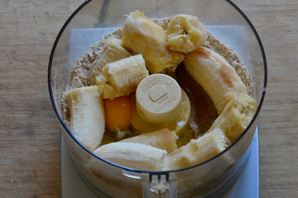 bananas and egg added to the oat flour in a food processor