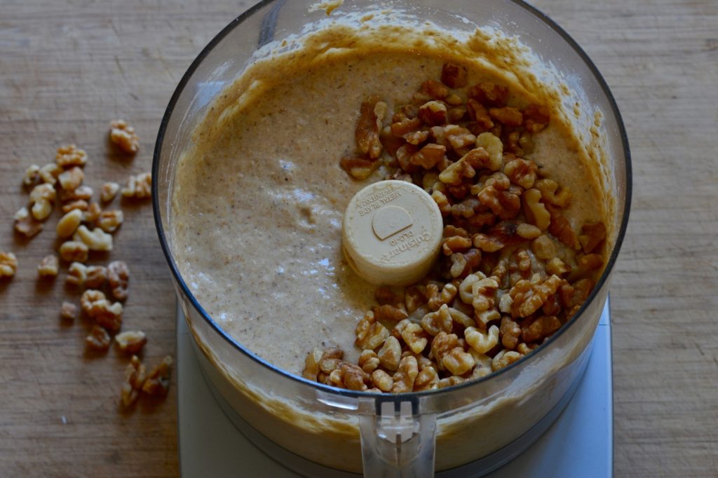 walnuts added to gluten free sugar free oat flour batter in a food processor